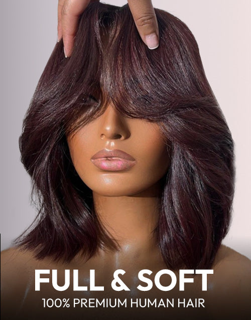 Model wearing a 99J burgundy red wavy short blunt cut bob glueless wig with curtain bangs