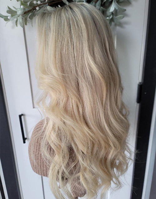 Side view of Betti lace frontal wig with ombre blonde waves.