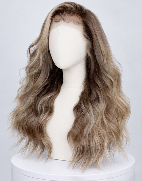 Three-quarter side view of a long wavy blonde balayage lace front wig on a mannequin