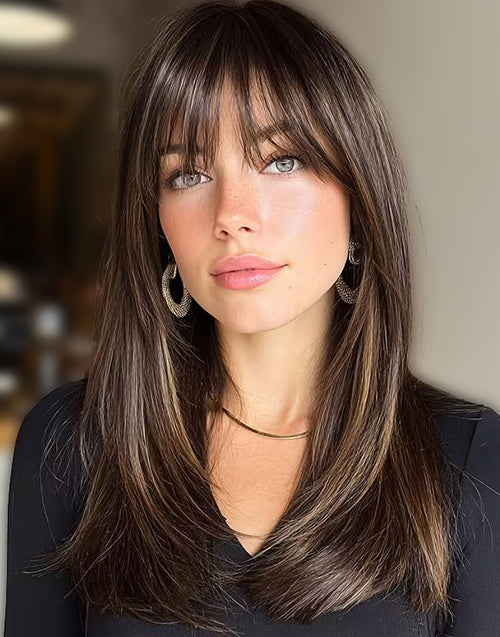 Front view of a brown wig with blonde highlights and straight layers.