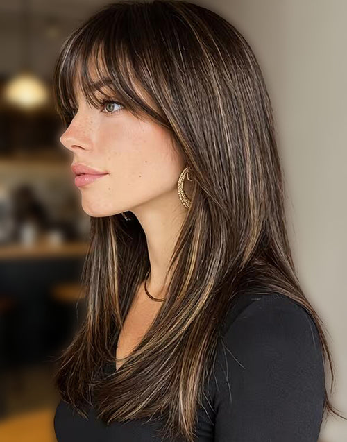 Side view of a brown straight layered wig with blonde highlights and curtain bangs.