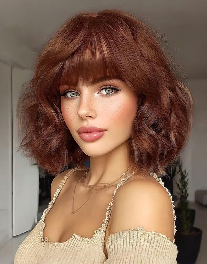 Front view of Jose natural auburn wavy bob wig showcasing full wispy bangs and soft textured waves.