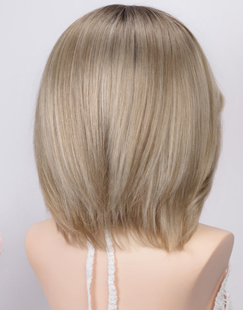 Back view of the Joy Minimalist Lace Wig, displaying smooth 100% human hair in Ombre Ash Blonde with layered bob ends and natural root depth on a mannequin.