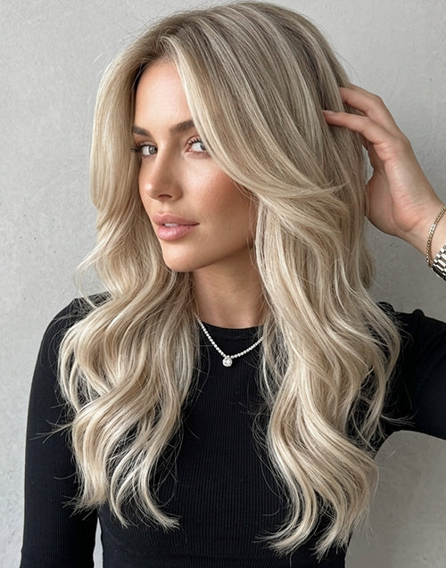 Light blonde balayage wavy lace wig on model.