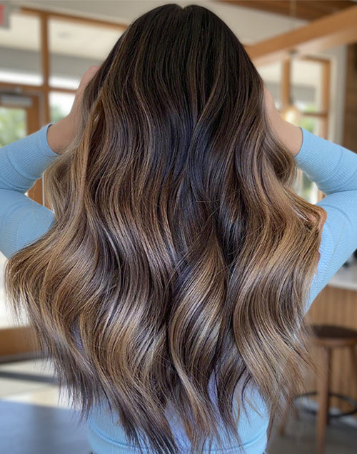 Back view of a mushroom brown blonde balayage wig showing blended color and wavy texture.