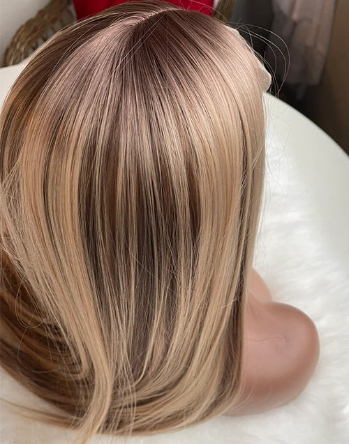 Close up of the natural warm blonde combo highlights in straight human hair.