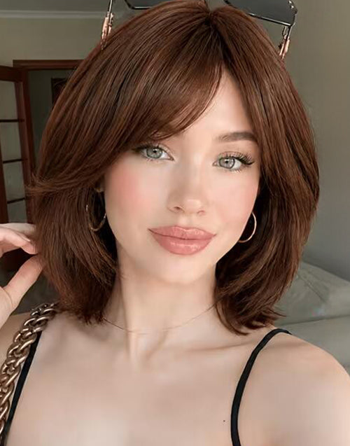 Model wearing Neena deep brown straight layered bob wig featuring natural curtain bangs.
