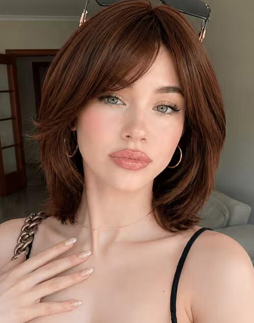 Front view of Neena deep brown layered bob wig showcasing side-swept curtain bangs.