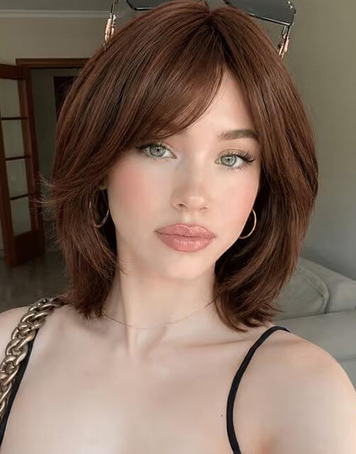 Side angle view of Neena deep brown straight layered bob wig with sweeping curtain bangs and soft hair layers.