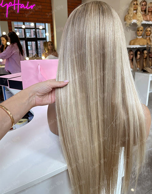 Back view of straight ash blonde full lace human hair wig with smooth layers.