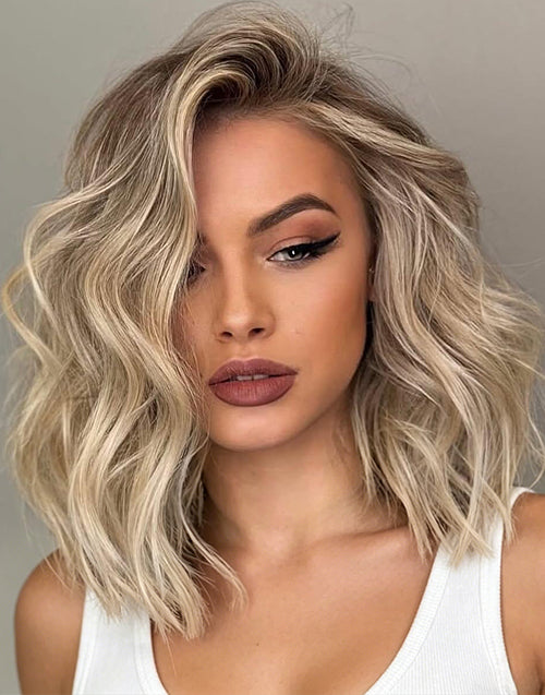 Front view of ash blonde wavy bob human hair wig with natural waves.