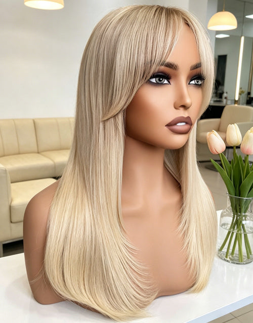An exquisite ash blonde long straight wig with french bangs and layered ends, styled and displayed. The wig features realistic texture and professional-grade construction.
