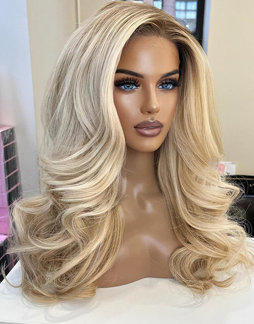 Ombre highlight blonde 13x6 lace front glueless human hair wig on a mannequin, featuring bouncy body waves and a realistic pre-plucked hairline.
