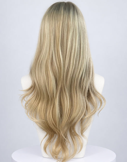 Back view of a long wavy platinum blonde balayage human hair wig on a mannequin