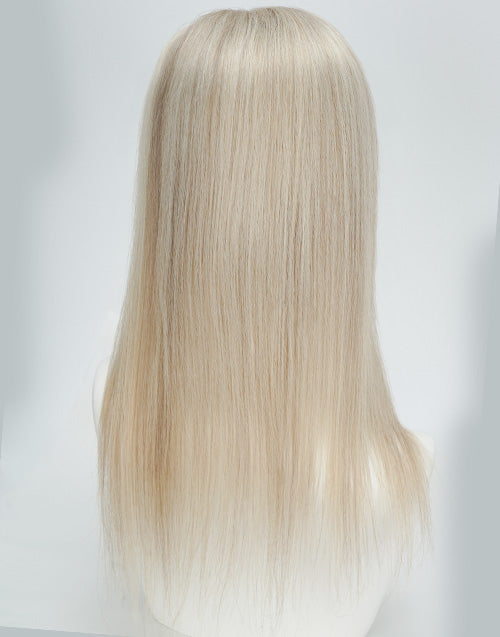 Back view of a straight platinum blonde human hair topper showing natural texture and smooth hair length.