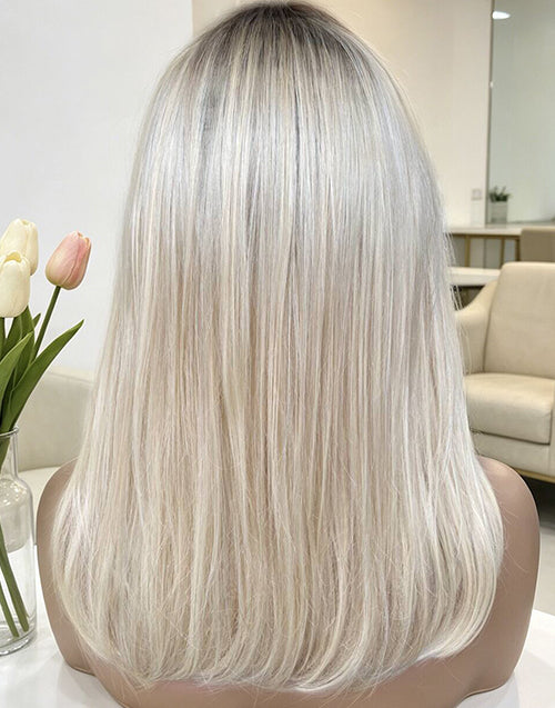 Back view of the Star Minimalist Lace Wig, displaying medium-length straight ash blonde ombre hair with dark roots.