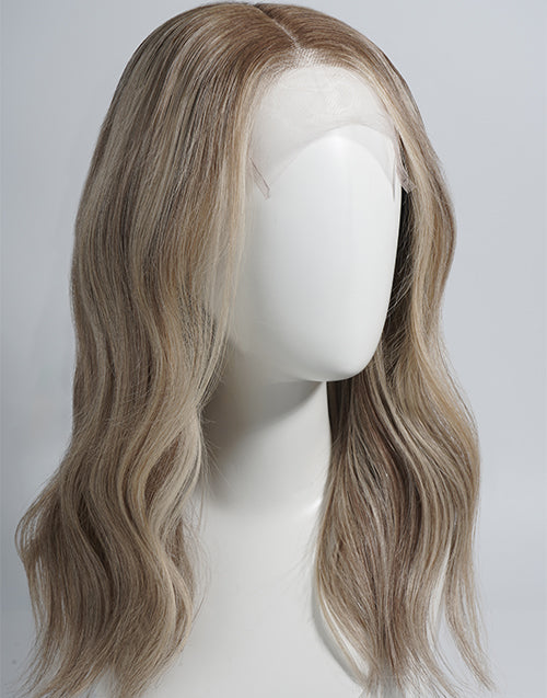 A shoulder-length wavy wig with a light brown and blonde ombré color, displayed on a white mannequin head against a light gray background.