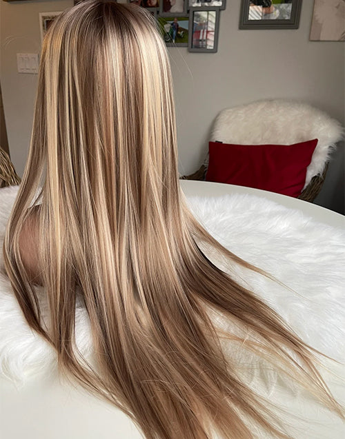 Back view of a straight warm blonde highlight wig showing its dimensional color.
