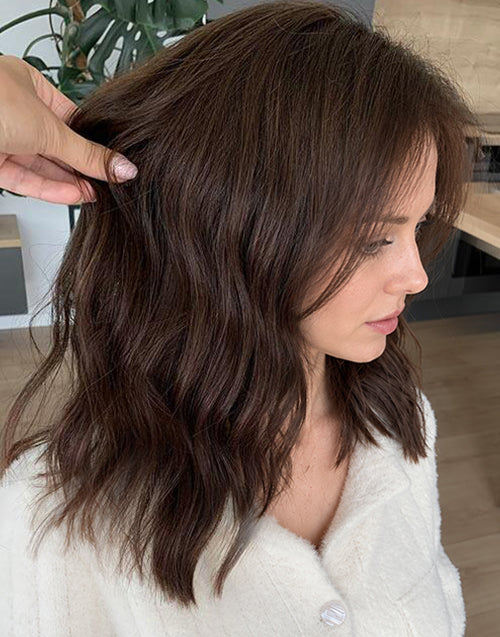 Detailed side view of Yushy medium chestnut brown 13x4 lace wig